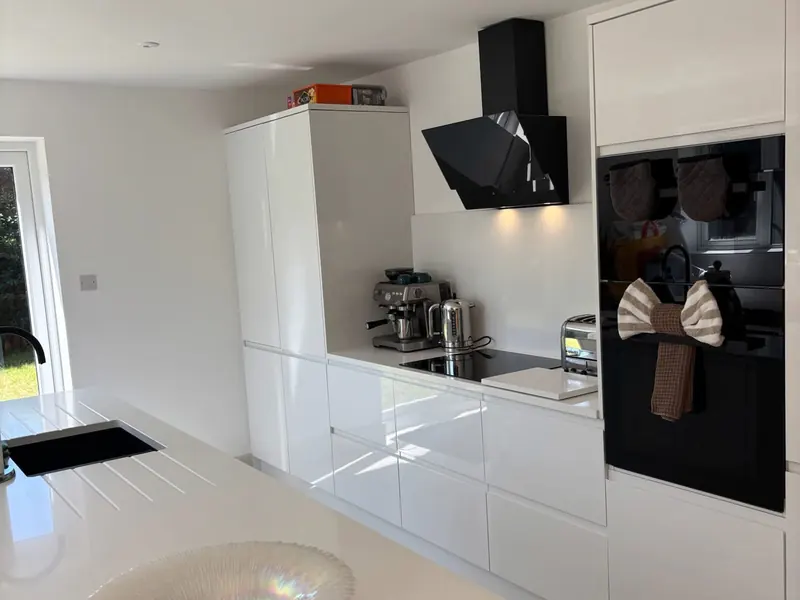 A bright white kitchen left clean from the units to the floor